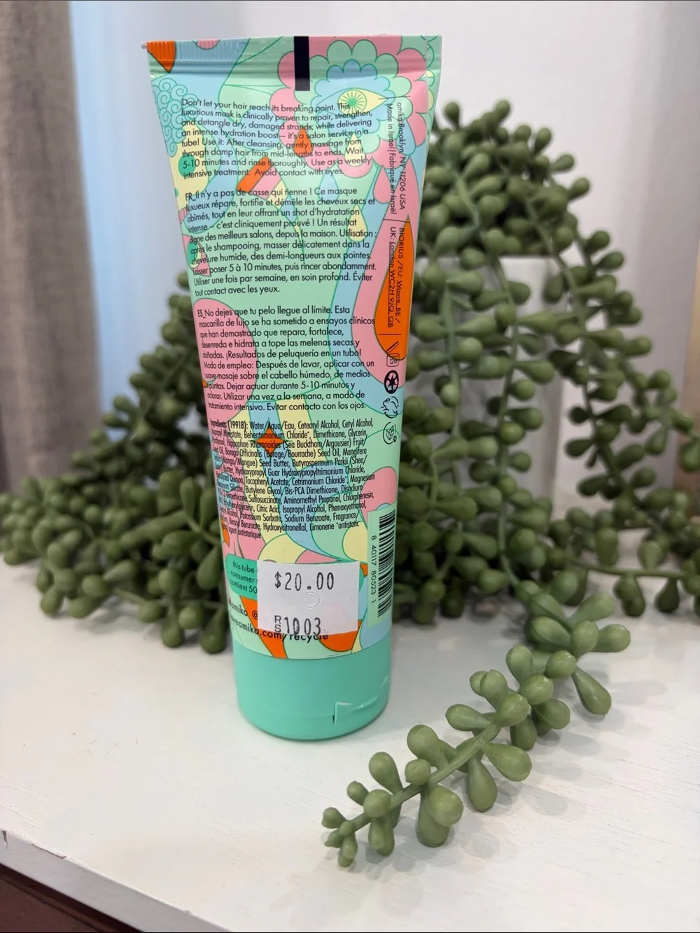 amika Mint Green Bond Repair Hair Mask with Colorful Floral Graphic
